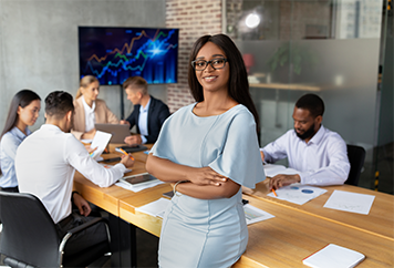 Woman leaning on desk at work